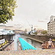 Historic harbour basin with floating swimming pool