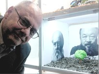 Barry poses with an Ai Weiwei-inspired sculpture he created for an art competition in his company
