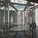 The main entrance foyer with the light columns, the transparent roof and the butterfly door handles on the main entrance doors. (Photo: Kari Palsila)