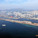 Aerial view of Kowloon East, former Kai Tak airport (foreground and left), Kowloon Bay (centre) and Kwun Tong district (right).