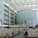 Visitors to the Sandra Day O'Connor Federal Courthouse pass through a very uncourtlike glass enclosed atrium which could aptly be described as a hothouse. The cylindrical glass center point houses a ceremonial courtroom. (Image via http://www.doney.net/aroundaz/phoenix-oconnor.htm)