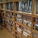 Bookcase and sunlight through the combination of glass and raw material