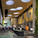 The David Rubenstein Atrium at Lincoln Center in New York City, which cobbles together 7,000 square feet of new public space for performances and Lincoln Center visitors out of the interstitial spaces between buildings. Newcomers and Lincoln Center regulars are treated to a 20-foot tall green wall and 16 skylight oculi, playfully scattered across the ceiling. (Image via twbta.com)