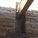 How the wooden beams meet the stone wall