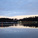 Logging boat gliding quietly through the lakes in Savonlinna, Finland.