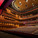 The main auditorium holds 1680 seats. The curved walls are made of 16.000 CNC cut solid bamboo blocks. The golden ceiling reflector design is inspired by the tradition Chinese opera mask. (Photo: Kari Palsila)