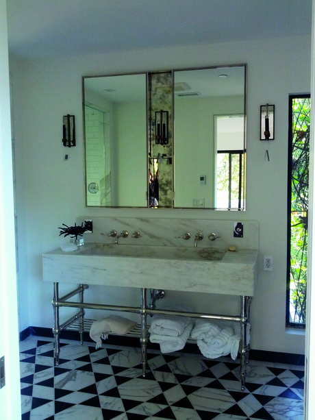 Custom built polished nickel medicine cabinet and custom CNC marble sink