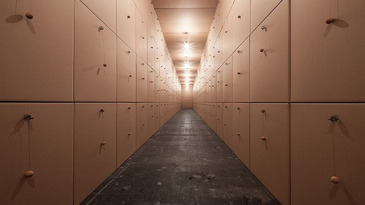 318 prepared dc-motors, cork balls, cardboard boxes 100x100x100cm by Zimoun