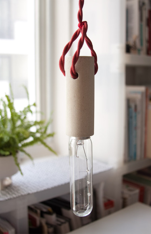 cylinder series – pendant : cast concrete socket with fabric covered wires and T10 light bulb.
