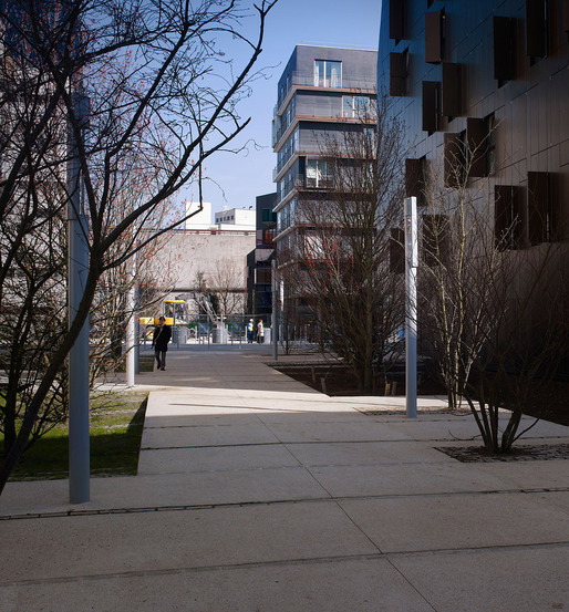Urban Insertion: "The project fits in a environment very rich architecturally and in its materiality. We have therefore conceived of an architecture possessing a double character responding to the urbanity of the Yves Kermen and Emile Zola streets, and the landscape of the Grande Traversée." (Photo: Julien Lanoo)