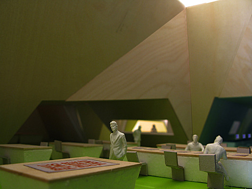 The reading room floor is divided between over-scaled skylight rooms for browsing archival materials and low dark spaces between for browsing materials online.