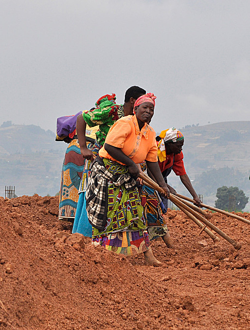 Women from community work during site preparation. (Photo courtesy of MASS Design Group)