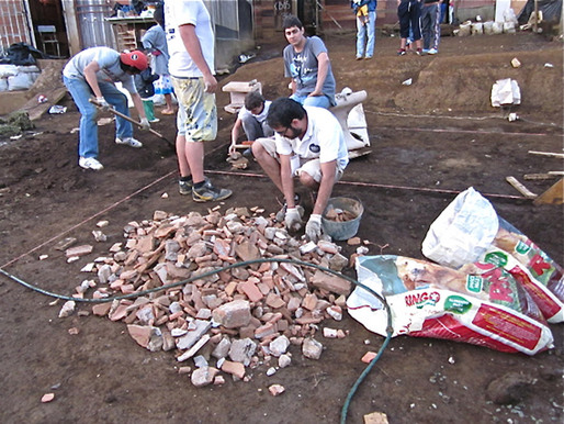 Gathering the waste material collected earlier in the workshop