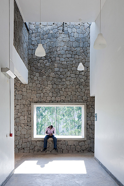 Sitting in the open window of the outpatient services area. (Photo: Iwan Baan)