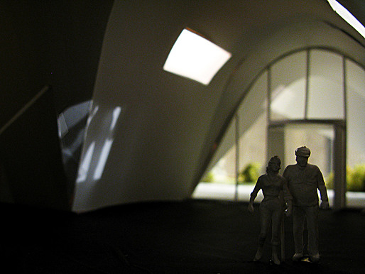 Entrance lobby lit by apertures from the public gallery mezzanine.