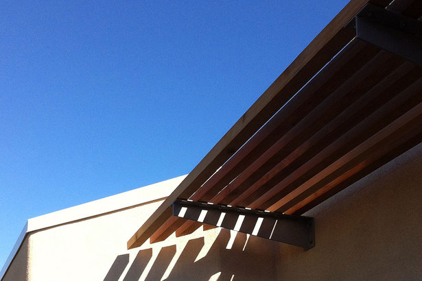 angled cedar trellis at front entry deck