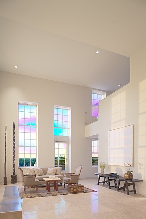 one of two double-height spaces - the living room - clg to dining room