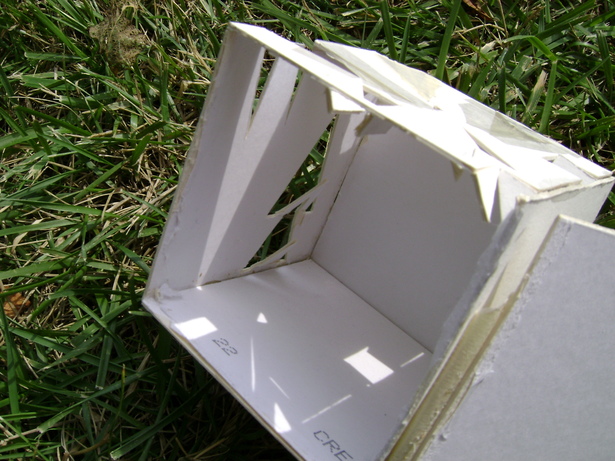 The inside of the painter’s cube. The ceiling contained spotlights that the painter could place objects under to paint. The walls had shapes cut into them large enough to allow light in and for the painter to look out on the world.
