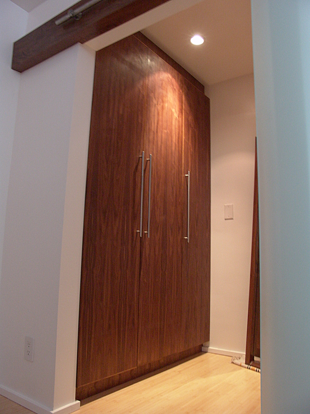 Walnut built-in cabinet with solid walnut header