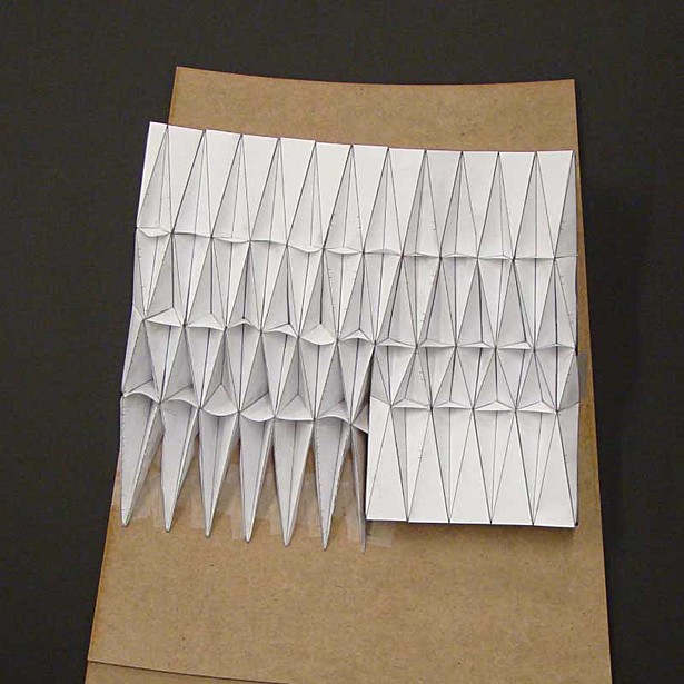Testig the sturcture, a dynamic model of the dam's folding system.