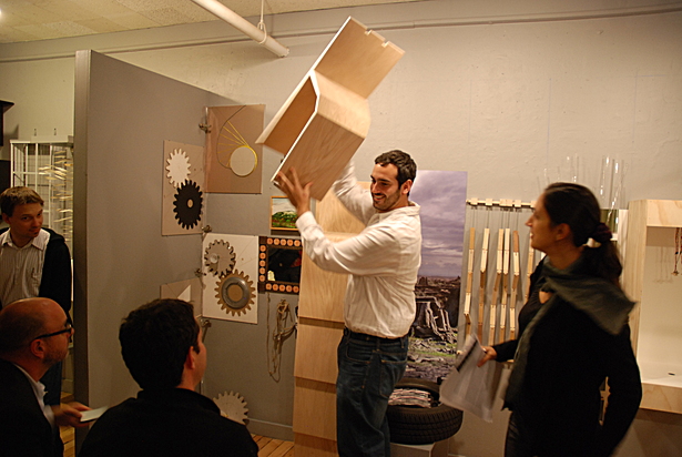 Chairs being removed from stack for critique.