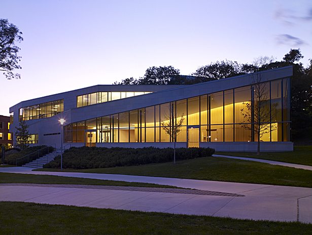 East elevation at dusk showing first interior waiting area