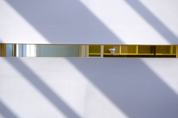 Light dances upon these angled surfaces and becomes the most important material of the building. (photo by R.Benson)