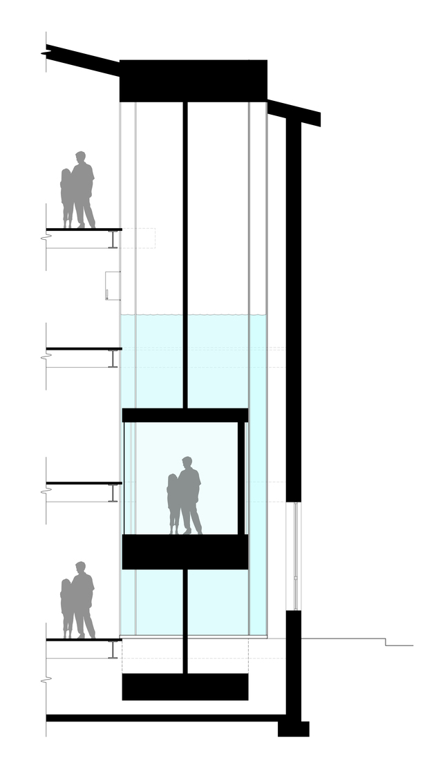 Elevator is inside of an aquarium with live fish