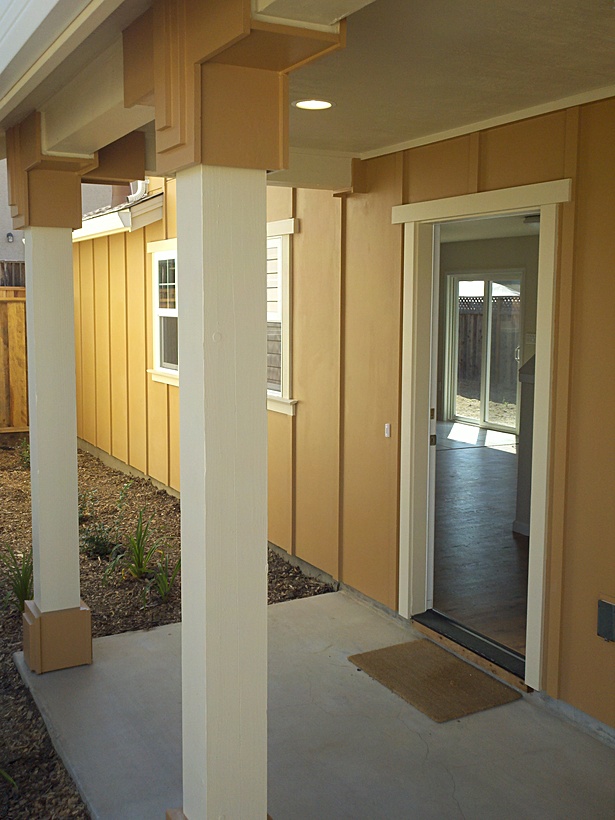 We let Harvey run wild with his column carpentry detailing. Each house has its own unique column detailing developed on-site by a volunteer who understood how each home should be special in it's own way. 
