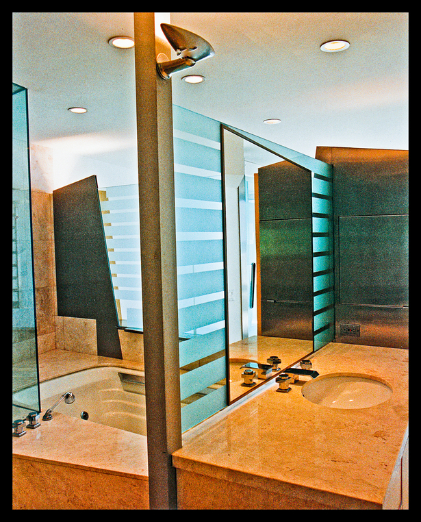 blasted glass/mirror partition between sink and tub area