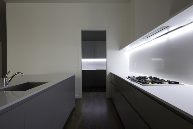 GLAM Kitchen: smooth matte gray Lacquer and CaesarStone quartz countertop.
