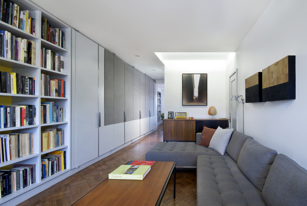 Daylight fluorescent light coves imitate skylights and amplify the natural light from windows within the apartment