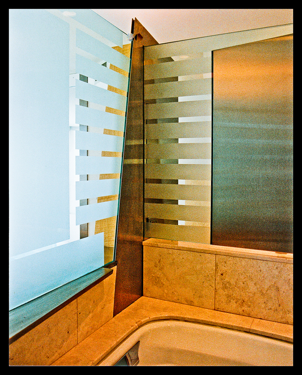 Glass, st. steel detail @Back of sink, bed head board, tub area.