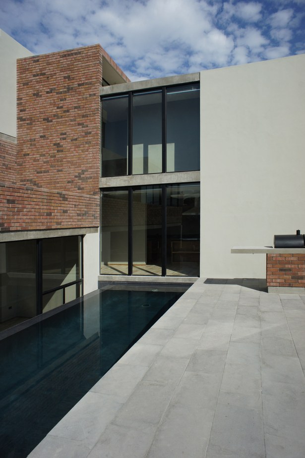 Pool and vertical circulation core