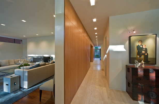 Entry foyer and wood feature wall that organizes the floor plan. 