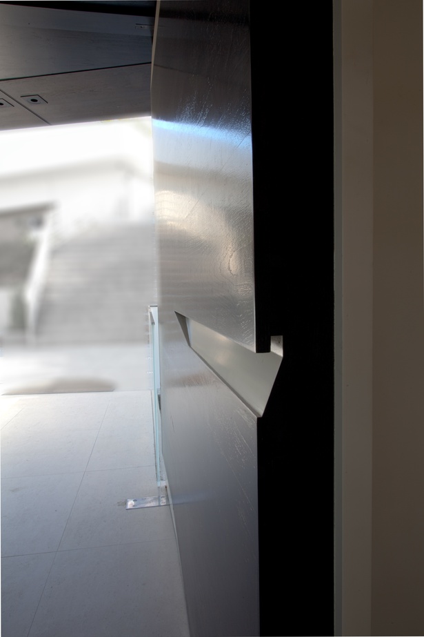 Custom designed, solid walnut entry door (photo: Imeh Akpanudosen)