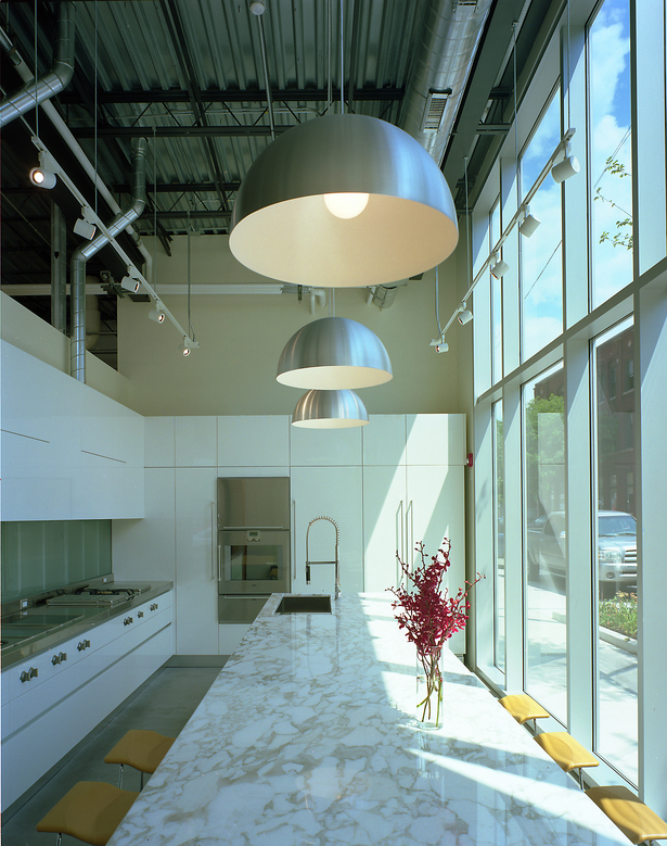This professional environment is a balance of work with fitness, rest and a healthy diet for the attorneys and staff that spend long days and nights in service to these clients. Private amenities include an elaborate training/fitness center, lounge area and a stunning, professional grade gourmet kitchen. (photo by Greg Murphey)