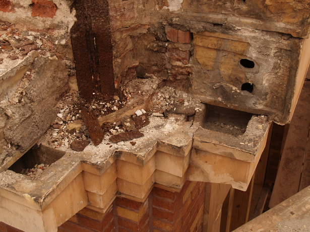 Terra cotta cornice, corroded steel