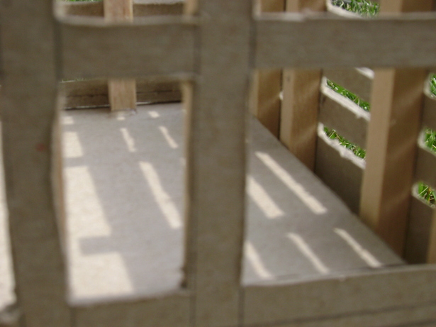 A close up photo. This showed how people within could look out and examine the environment from within. Also, nature could look in on the people within the building.