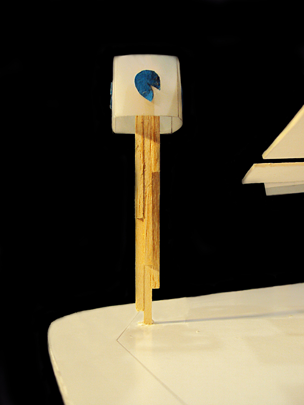 translucent cube on geometric column