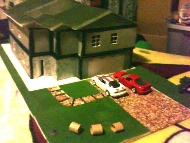 front house with automobiles.
