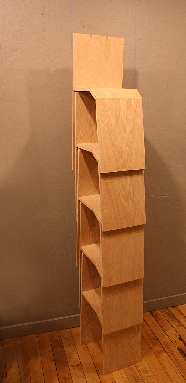 As stipulated by the gallery, the chairs stack within the 18" space allowed. The supports under each seat key into the crown of the chair below to lock the stack in place.