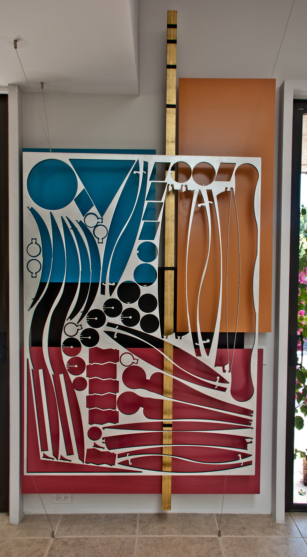 Waterjet cut aluminum panel, suspended from st.st. cables.