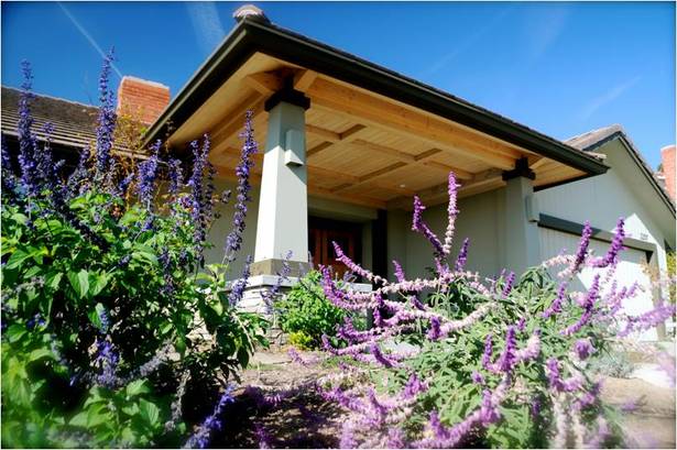 At the front porch I designed a dropped ceiling to create a welcoming and intimate sense of entry.