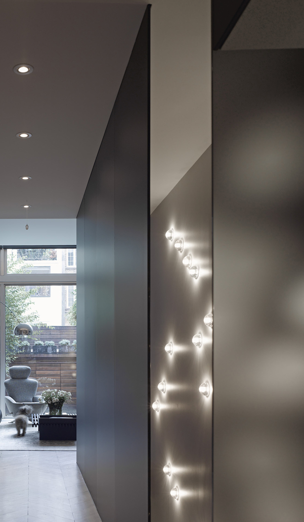 The glass-enclosed staircase complete with lighting in the arrangement of a constellation