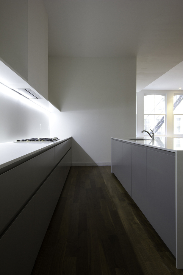 GLAM Kitchen: smooth matte gray Lacquer and CaesarStone quartz countertop.