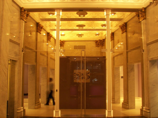 New Column Replicas placed in modern glass wall at interior for entrance to new gym amentities