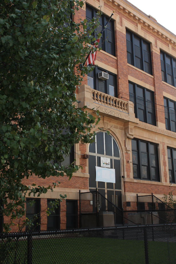 Terra cotta and brick replacement and repair, entry facade.