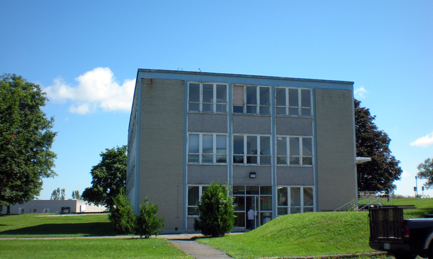 Existing photo of the building in its derelict state