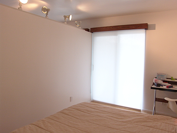 Partition wall and covered sliding door with walnut casement boxes
